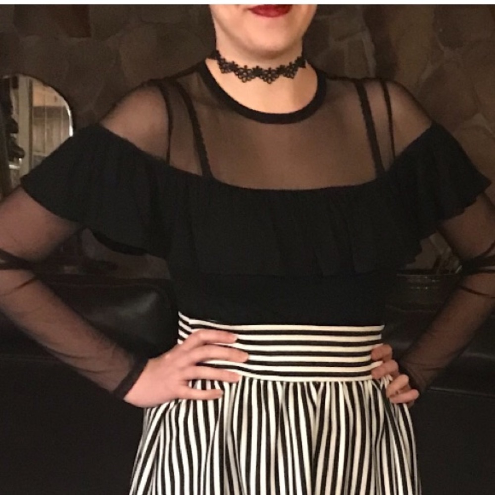 Mesh sleeves and shoulders,ruffle detail, knit top